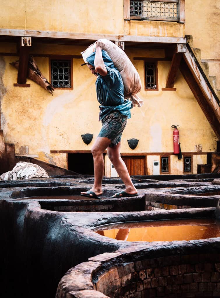 What's in My Camera Bag - Photography Essentials and Best Cameras for Travel Bloggers and Travel photography 19 tanneries of Fez - hard work - tanning process - Journal of Nomads