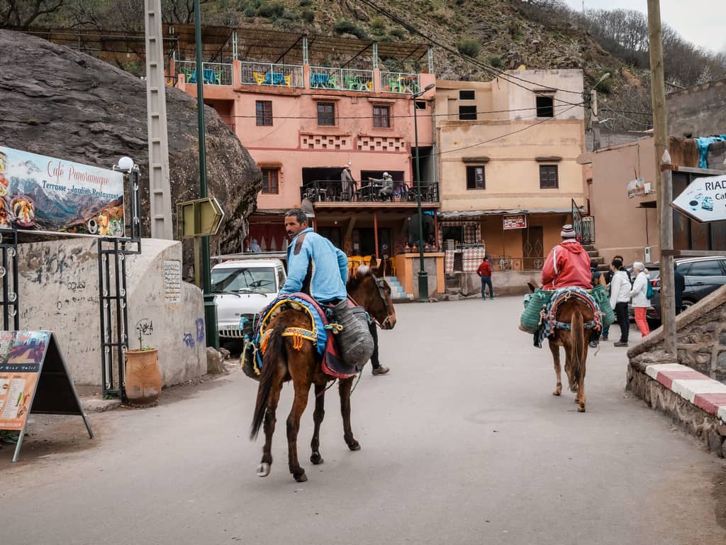 street of imlil morocco - man riding horse in imlil morocco - toubkal morocco - journal of nomads