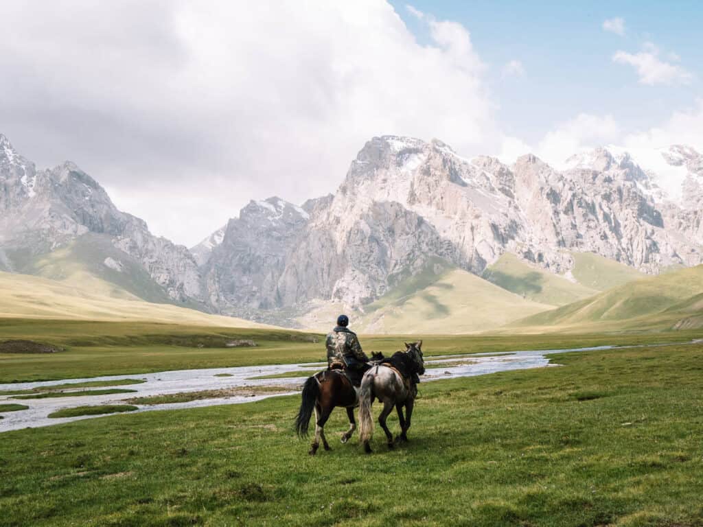 Why Visit Kyrgyzstan: 12 Reasons why I fell in love with this special country in Central Asia 65 Kyrgyzstan Travel Guide - Travel to Kyrgyzstan - Visit Kyrgyzstan - Kok Kiya Valley - horseman - Journal of Nomads- renew visa for Kyrgyztan